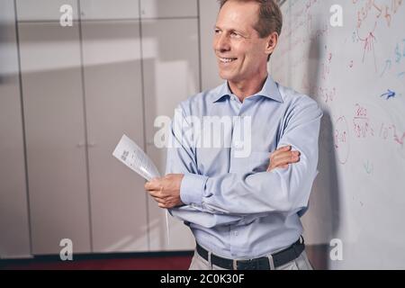 Kind elderly man being deep in his thoughts Stock Photo