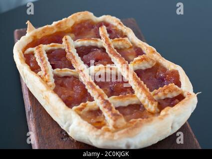 Pie with red onions and smoked cheese Stock Photo