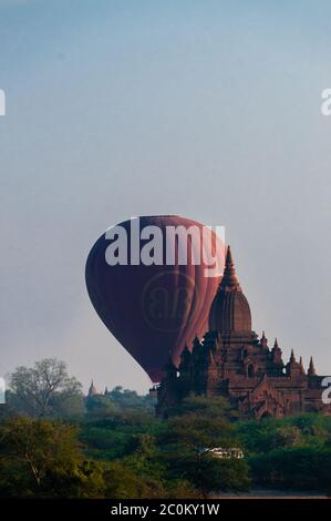 Hot air balloon behind temple in Bagan Stock Photo