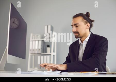 Successful businessman busy working typing on laptop Stock Photo - Alamy