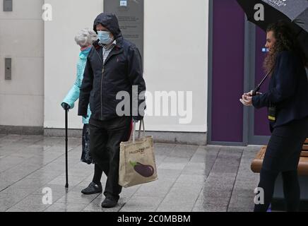 People arrive at the Victoria Square shopping centre, Belfast, after all shopping centres and retailers were given the green light to reopen in a significant relaxation of coronavirus lockdown restrictions in Northern Ireland. Stock Photo