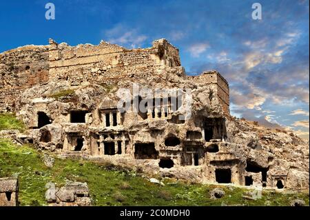 Tlos acropolis and Lycian house and temple-type rock-cut tombs. Tlos is where the mythological hero Bellerophon winged flying horse Pegasus lived. Ana Stock Photo