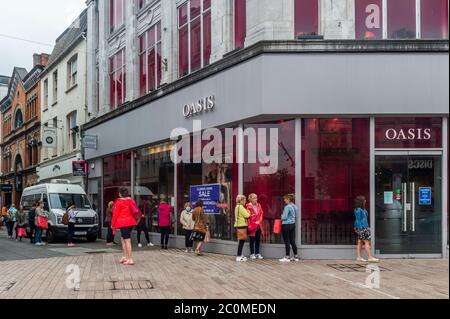 Cork, Ireland. 12th June, 2020. Oasis in Ireland has gone into liquidation. There was a big queue to take advantage of the liquidation sale in the Cork City store this morning. Credit: AG News/Alamy Live News Stock Photo
