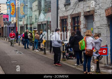 Cork, Ireland. 12th June, 2020. Big queues were in evidence this morning for Smyths Toys shop in Cork City. Credit: AG News/Alamy Live News Stock Photo