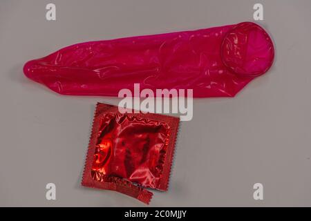 Display of colored condom arranged neatly on a platform Stock Photo
