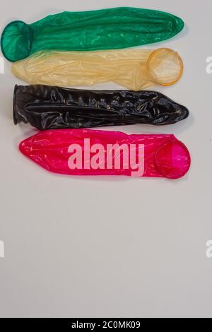 Display of colored condoms arranged neatly on a platform Stock Photo