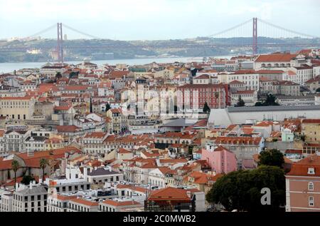 Lisbon rises on the coast and is on a hilly area. From São Jorge Castle, the view is on the pastel-colored buildings of the old city Stock Photo