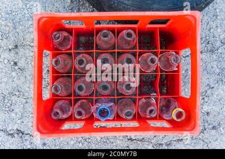 glass bottles in plastic crate Stock Photo