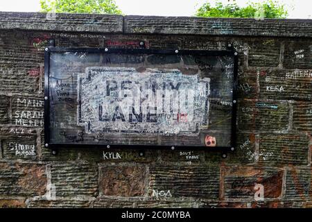 The protected road sign for Penny Lane, made famous by The Beatles and signed by Paul McCartney, in Liverpool, cleaned up after it was vandalised following perceived links with slave trader James Penny. Stock Photo