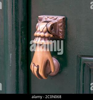 vintage hand shaped door knocker Stock Photo