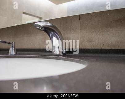 Faucet modern in restroom Stock Photo