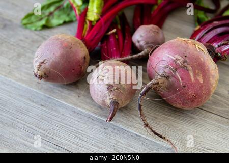 Red beetroots on wooden table Stock Photo