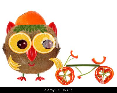 Creative food concept. Little  Owl made from kiwi and orange Stock Photo