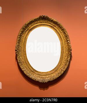 Old-fashioned oval frame on wall Stock Photo
