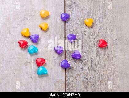Heart shaped candy on wooden background Stock Photo