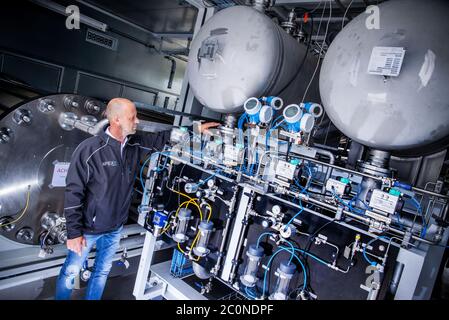 Laage, Germany. 12th June, 2020. Plant manager Guido König from the company Apex Energy is testing the electrolysis plant in what the company says is the largest grid-connected hydrogen power plant in Europe. From autumn 2020, Apex will supply green energy for industry and commerce, housing companies, public transport or for the intermediate storage of control energy. Up to 300 tons of hydrogen can be produced annually from exclusively renewable energy sources. Credit: Jens Büttner/dpa-Zentralbild/dpa/Alamy Live News Stock Photo