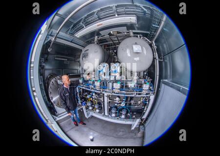 Laage, Germany. 12th June, 2020. Plant manager Guido König from the company Apex Energy is testing the electrolysis plant in what the company says is the largest grid-connected hydrogen power plant in Europe. From autumn 2020, Apex will supply green energy for industry and commerce, housing companies, public transport or for the intermediate storage of control energy. Up to 300 tons of hydrogen can be produced annually from exclusively renewable energy sources. Credit: Jens Büttner/dpa-Zentralbild/dpa/Alamy Live News Stock Photo
