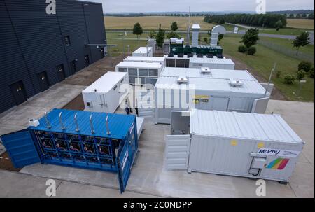 Laage, Germany. 12th June, 2020. According to the company, the largest grid-connected hydrogen power plant in Europe, built by the company Apex Energy. From autumn 2020, Apex will supply green energy for industry and commerce, housing companies, public transport or for the intermediate storage of control energy. Up to 300 tons of hydrogen can be produced annually from exclusively renewable energy sources. Credit: Jens Büttner/dpa-Zentralbild/dpa/Alamy Live News Stock Photo