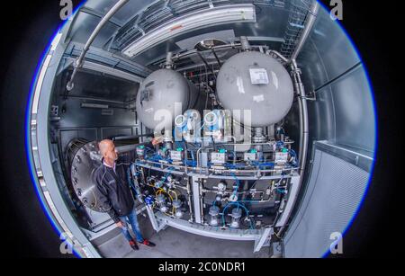 Laage, Germany. 12th June, 2020. Plant manager Guido König from the company Apex Energy is testing the electrolysis plant in what the company says is the largest grid-connected hydrogen power plant in Europe. From autumn 2020, Apex will supply green energy for industry and commerce, housing companies, public transport or for the intermediate storage of control energy. Up to 300 tons of hydrogen can be produced annually from exclusively renewable energy sources. Credit: Jens Büttner/dpa-Zentralbild/dpa/Alamy Live News Stock Photo
