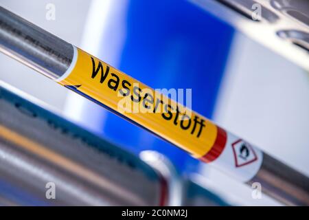 Laage, Germany. 12th June, 2020. A pipeline marked with the inscription 'Hydrogen' has been laid in the fuel cell of Europe's largest grid-connected hydrogen power plant by the company Apex Energy. From autumn 2020 on, Apex will supply green energy for industry and commerce, housing companies, public transport or for the intermediate storage of control energy. In this way, up to 300 tons of hydrogen can be produced annually from exclusively renewable energy sources. Credit: Jens Büttner/dpa-Zentralbild/dpa/Alamy Live News Stock Photo