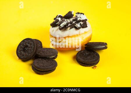 Chocolate biscuit and white cream chocolate doughnut Stock Photo
