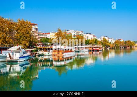 Tourist cruise boat at Manavgat river in Manavgat city centre in Antalya region in Turkey Stock Photo