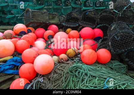 Close-up of crab pots, fishing lines and floats on The Common, Holy Island of Lindisfarne, Northumberland, England, UK Stock Photo