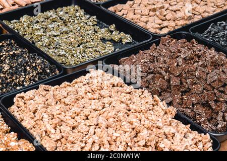 Traditional Korean sweets with baked nuts sold in Seoul South Korea Stock Photo