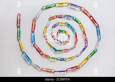 Paperclip chain spiral, Paperclips chain spiral, isolated on white background - paper clips, paper clip abstract Stock Photo