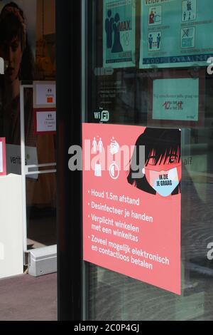 AALST, BELGIUM 12 JUNE 2020: 'Safe shopping' COVID-19 advice on a sign outside a shop in the town centre of Aalst. Stock Photo