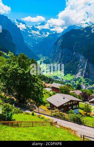 Traditional local houses in Wengen village in the Interlaken district in the Bern canton of Switzerland Stock Photo