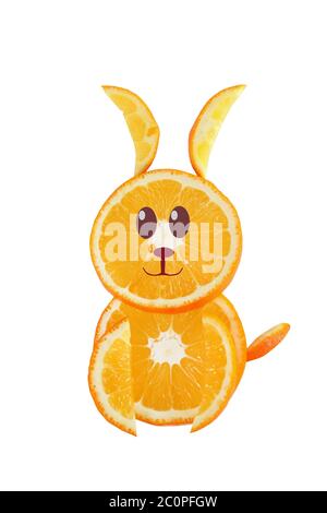 Healthy eating. Funny little rabbit made of the orange slices. Stock Photo