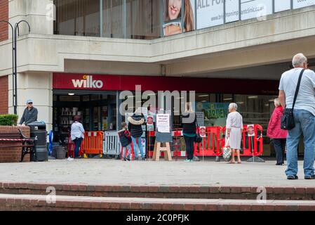 People queue outside a Wilko store during the Coronavirus COVID-19 pandemic crisis in Worthing, Sussex, UK. Stock Photo