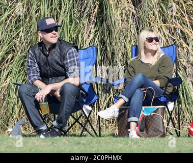 Reese Witherspoon, husband Jim Toth and ex husband Ryan Phillippe watch their son Deacon Phillippe play soccer in Brentwood, California. November 2012