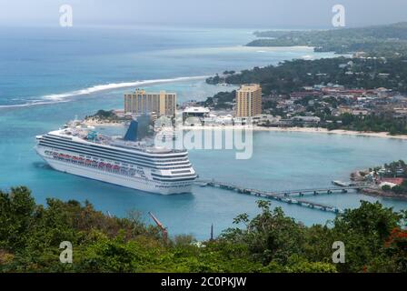 The aerial view of a cruise ship moored in Ocho Rios resort town bay (Jamaica). Stock Photo