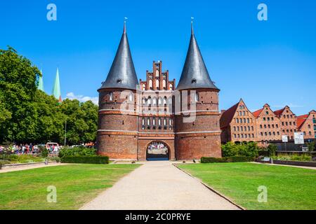 Holsten Gate or Holstein Tor or later Holstentor is a city gate and museum in the Lubeck old town in Germany Stock Photo