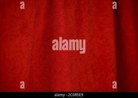 Blood red bath towel background. The texture of the fabric is red terry Stock Photo