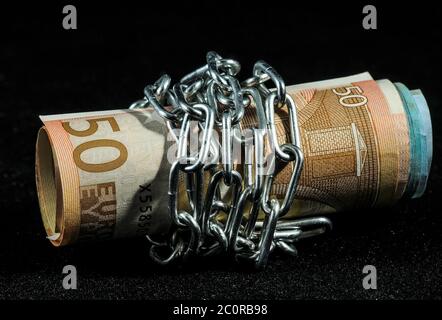 Money in chains Stock Photo
