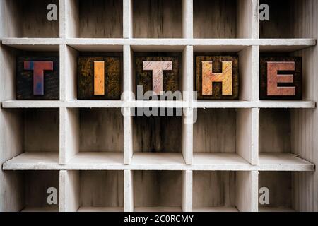 Tithe Concept Wooden Letterpress Type in Drawer Stock Photo