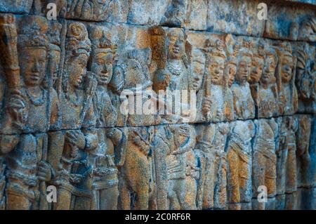 Full body Brahman Buddha stone Carvings at Borobudur temple Stock Photo