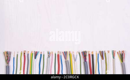 Electric wires on white background, top view with copy space Stock Photo