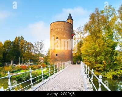 Old stone spillway tower at Minnewater lake, aka Lake of Love, in Bruges, Belgium. Stock Photo