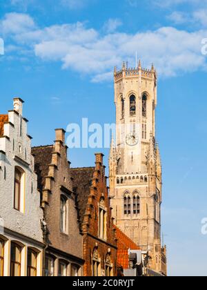 The Belfry Tower, aka Belfort, of Bruges, medieval bell tower in the historical centre of Bruges, Belgium. Close-up view of the top. Stock Photo