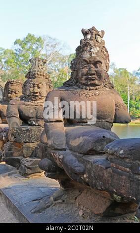 Rows of gods lining the path to the South entrance or gate of Angkor Thom temple complex, Siem Reap, Cambodia, Asia Stock Photo