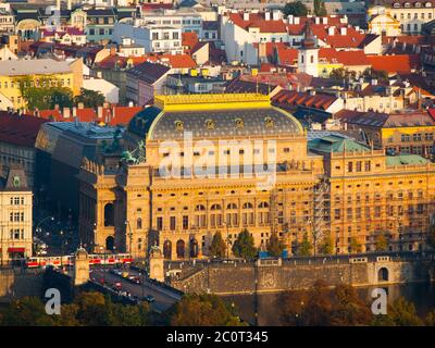 Illuminated historical building of Prague National Theatre on Vltava River embankment. Evening view from Petrin Hill, Prague, Czech Republic, Europe Stock Photo