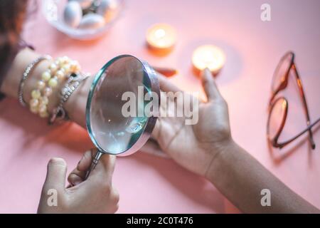 palmistry fortune teller reads lines on hand or palm to tell future. Stock Photo