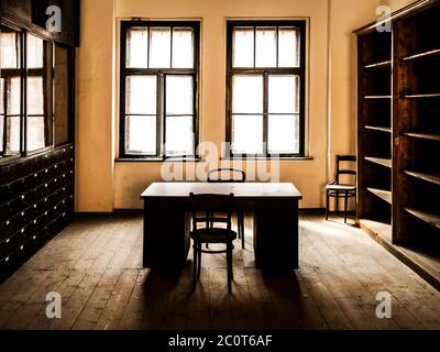 Retro style office room with wooden table, old chairs and cabinets. Vintage theme. Stock Photo