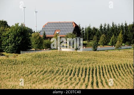 GERMANY, energy mix, energy transition, village with wind energy, house with solar panel, maize field, maize is used in biogas plant Stock Photo