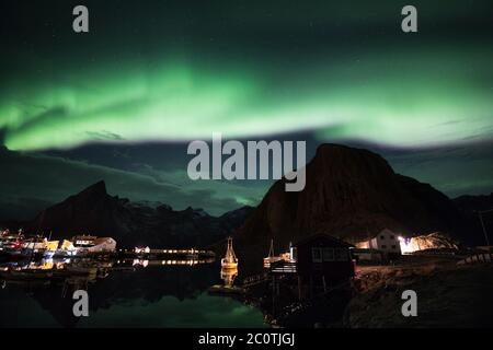 A traditional fishing boat in Hamnoy ( Lofoten ). Stock Photo