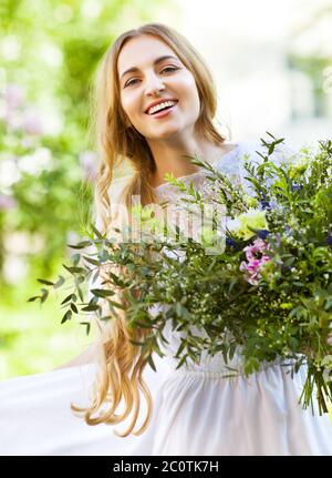 Bride with beautiful wedding bouquet of flowers in the style of boho Stock Photo